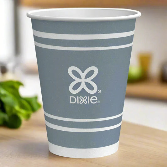 Blue Dixie disposable paper cup with white stripes on a wooden surface with blurred kitchen background