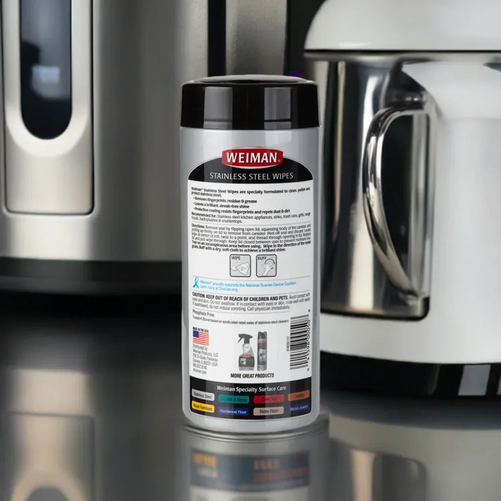 Weiman Stainless Steel Wipes container placed on kitchen counter beside stainless steel appliances