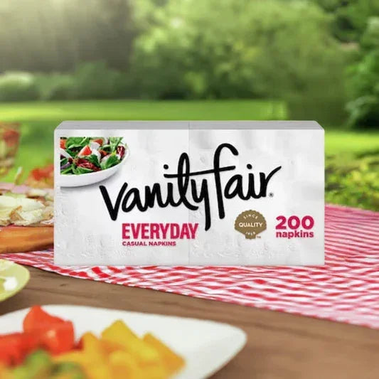 Vanity Fair Everyday casual napkins pack with 200 napkins on picnic table with food and greenery