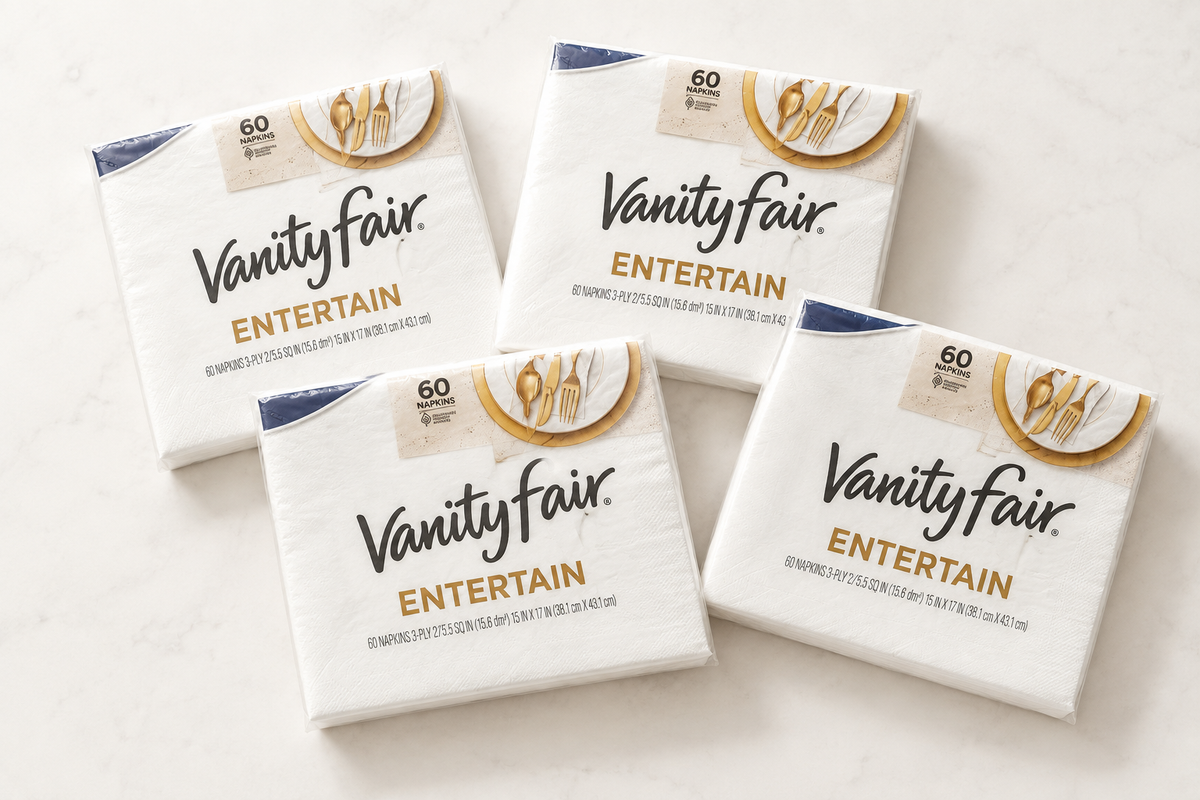 Four Vanity Fair Entertain napkin packs, each containing 60 napkins, arranged at slight angles on a white surface