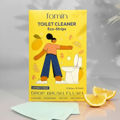 Fomin lemon citrus toilet cleaner eco-strips package with illustration and lemon slices on white surface