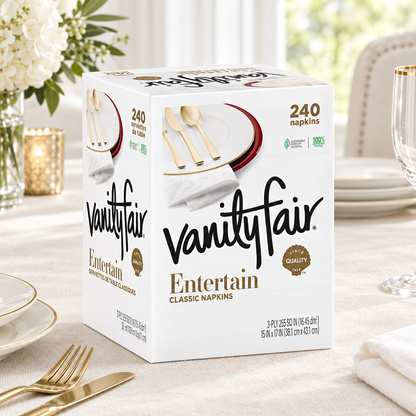 Vanity Fair Entertain Classic Napkins box with white tableware and gold-tone cutlery on a light table
