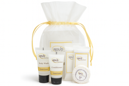 Studio product photography of hotel amenity kit with all items visible