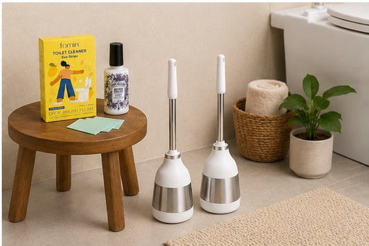 Modern rust-resistant stainless steel toilet brush showing bristle head in a clean bathroom setting.
