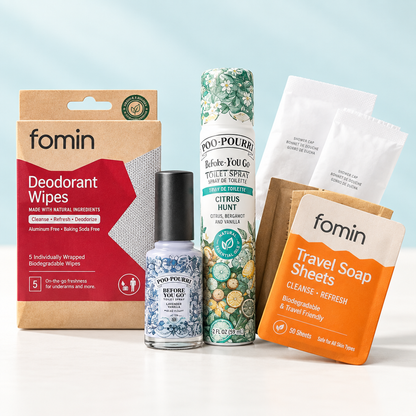 TSA-approved travel toiletries kit featuring Fomin deodorant wipes, travel soap sheets, and Poo-Pourri spray